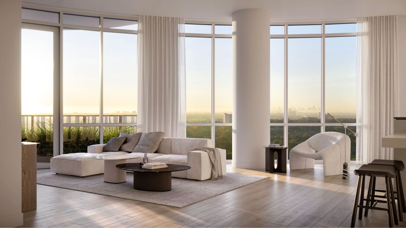 Alba suite living room with floor-to-ceiling windows and sunrise view